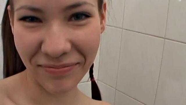 Babe showing off pussy before pissing and showering