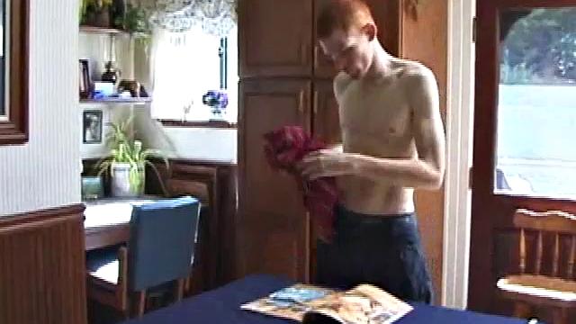 Always horny red haired skater covers the kitchen table with a large towel, stretches out a tape measure the length of the table, grabs a porn magazine, removes his shirt, and gets right down to business.