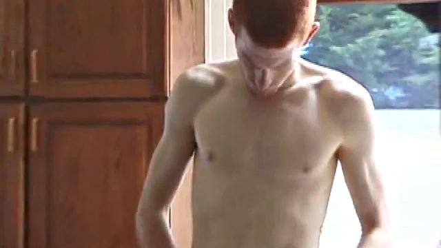 Always horny red haired skater covers the kitchen table with a large towel, stretches out a tape measure the length of the table, grabs a porn magazine, removes his shirt, and gets right down to business.
