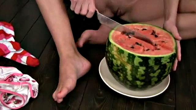 Cute Christina squashing a watermelon
