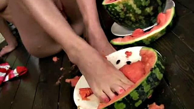 Cute Christina squashing a watermelon