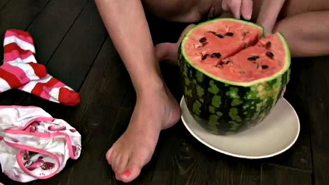Cute Christina squashing a watermelon