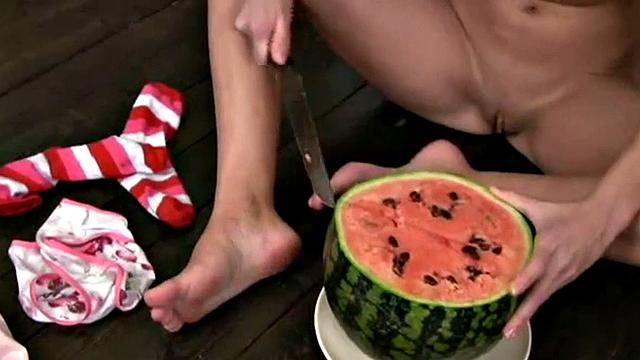Cute Christina squashing a watermelon