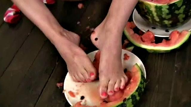 Cute Christina squashing a watermelon