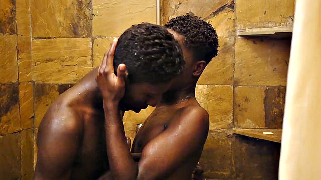 Sucking black twink from behind in erotic action