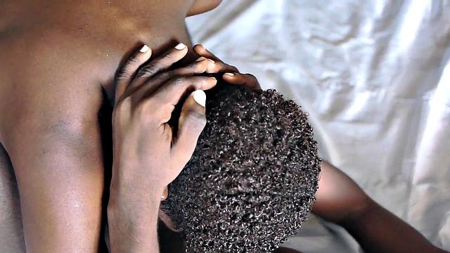 Sucking black twink from behind in erotic action