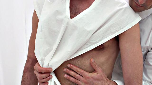 Hairy preacher top gets drilled by a bareback twink while giving a handjob in the kitchen