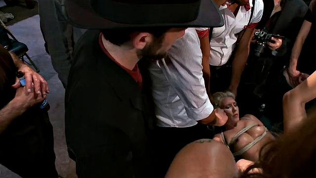 Public BDSM anal babe gangbanged in front of viewers