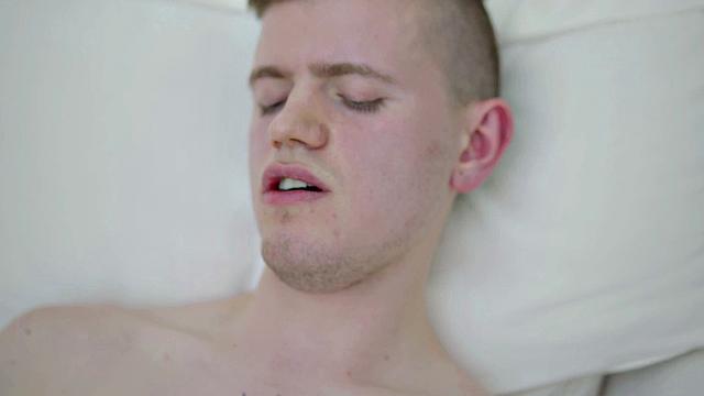 Tattooed twink tugging thick cock while showing body