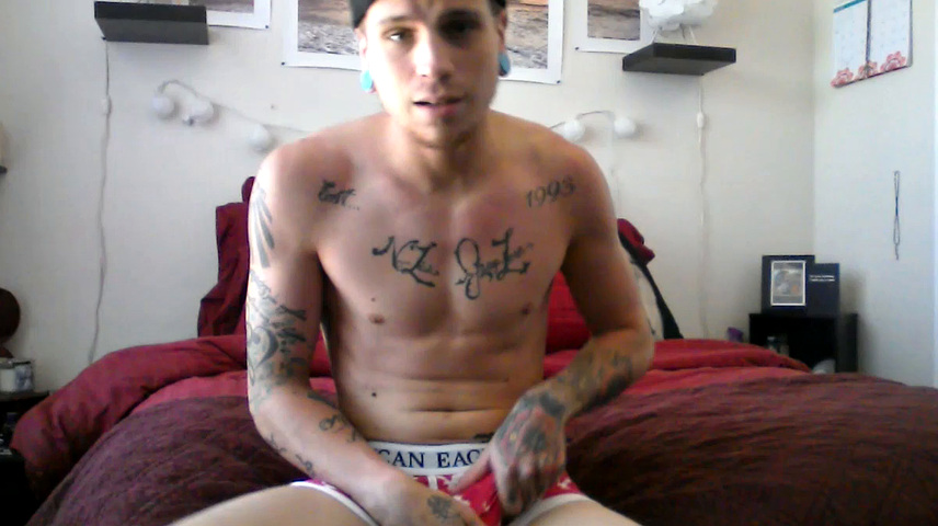 Robbie Callahan is an exhibitionist, and really gets into stroke shows. With all those tattoos, he's definitely got the bad boy look going on and we get to see his body art, as the camera moves in close, while he gets naked.