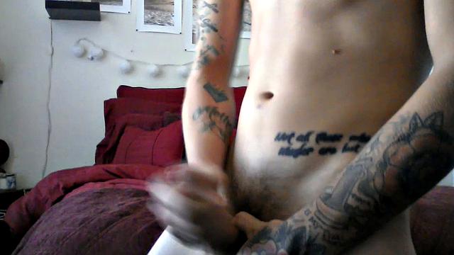 Robbie Callahan is an exhibitionist, and really gets into stroke shows. With all those tattoos, he's definitely got the bad boy look going on and we get to see his body art, as the camera moves in close, while he gets naked.