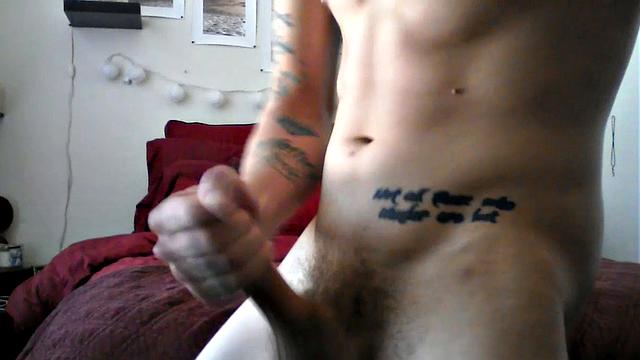 Robbie Callahan is an exhibitionist, and really gets into stroke shows. With all those tattoos, he's definitely got the bad boy look going on and we get to see his body art, as the camera moves in close, while he gets naked.