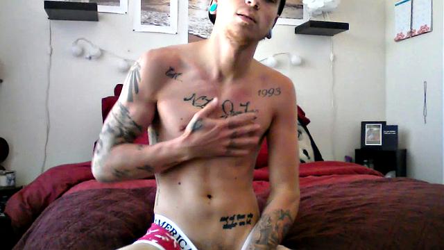 Robbie Callahan is an exhibitionist, and really gets into stroke shows. With all those tattoos, he's definitely got the bad boy look going on and we get to see his body art, as the camera moves in close, while he gets naked.