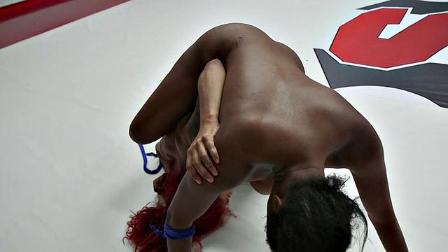 Lez redhead wrestler dominates over Ebony babe in arena