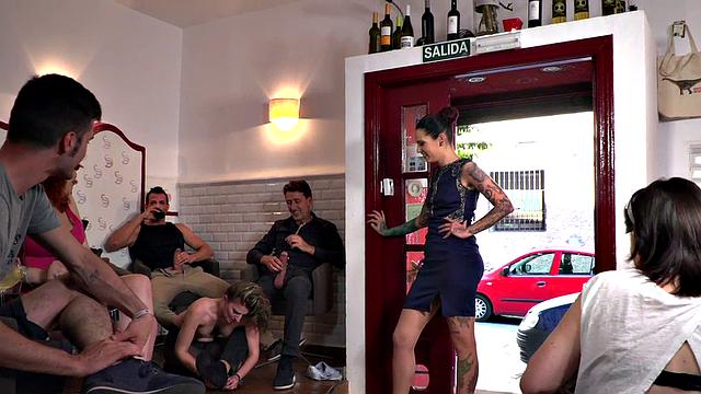 A tattooed slut get down and dirty with her toes and balls in public