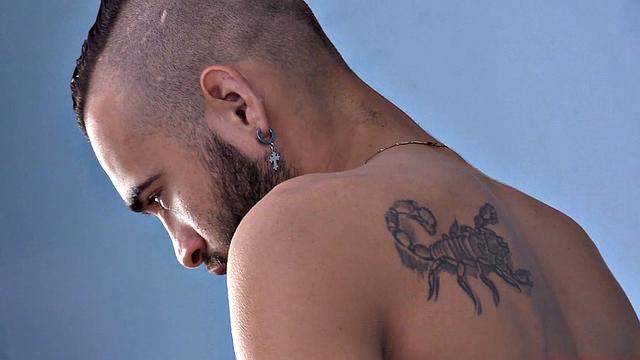 We watch as Ak strips naked and works up a stiff one. Then we are treated to a look at his fine little hairy butt, before the stroke show begins. After beating off, the horny Latino kicks back on a sofa and continues his mission.