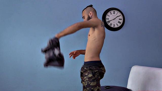 We watch as Ak strips naked and works up a stiff one. Then we are treated to a look at his fine little hairy butt, before the stroke show begins. After beating off, the horny Latino kicks back on a sofa and continues his mission.