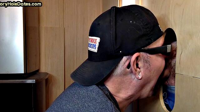 Real gloryhole DILF jerks BFs cock at home