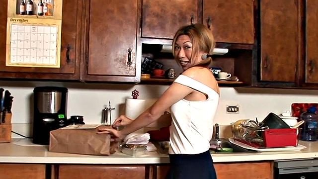 Happily married Taiwanese beauty Veronica diddles her tight cunt in the kitchen with a vibrator