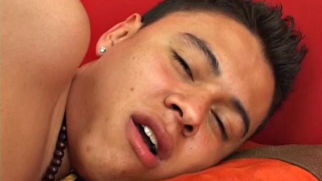 Tato is a cute young Latino with a big uncut cock that he is happy to show after stripping naked on the bed.