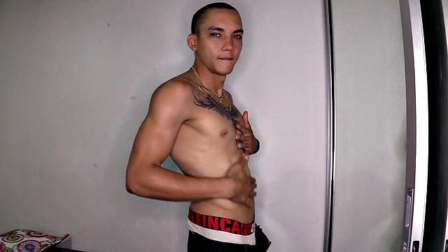 After stripping to his underwear, Kayser kicks back on a bed, revealing a monster cock. He quickly gets hard and starts jerking off.