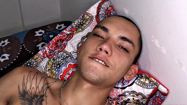 After stripping to his underwear, Kayser kicks back on a bed, revealing a monster cock. He quickly gets hard and starts jerking off.