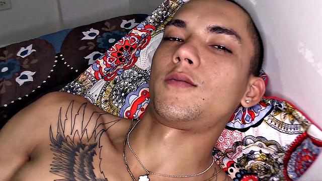 After stripping to his underwear, Kayser kicks back on a bed, revealing a monster cock. He quickly gets hard and starts jerking off.