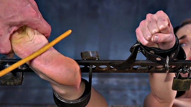 Predicament bondage redhead used in feet torment BDSM