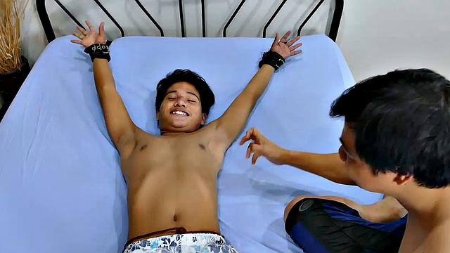 This cute ticklish Asian boy returns for a old tie and tickle session with Daddy Mike and Vahn Valdez. Fully equipped with feathers, hairbrush, and lubricant, Daddy and Vahn put this little twink through tickling hell.