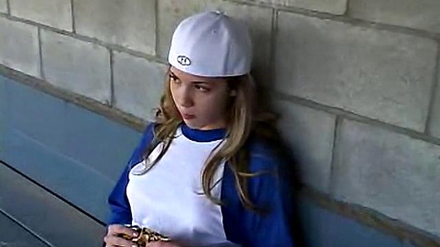 Little April Plays After A Game Of Baseball