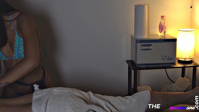 Real stunning ebony masseuse wanks client's cock