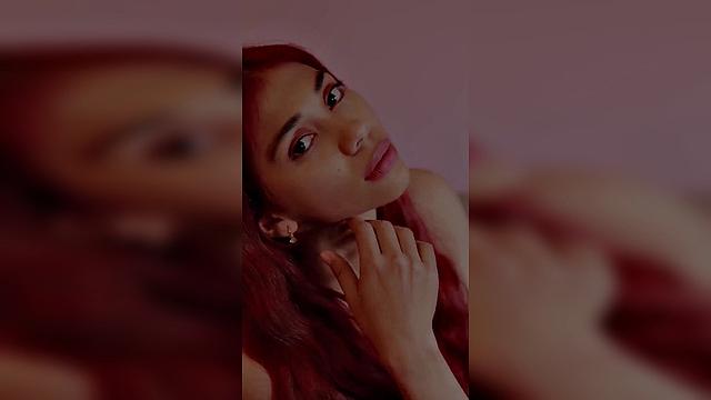 redhead with long hair in pink outfit, seductive