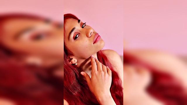 redhead with long hair in pink outfit, seductive