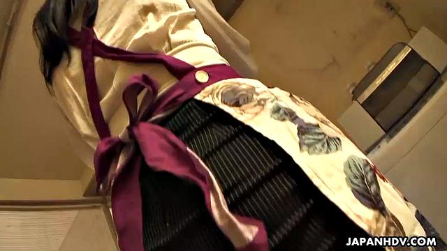 Dark haired Asian sucks a big pecker