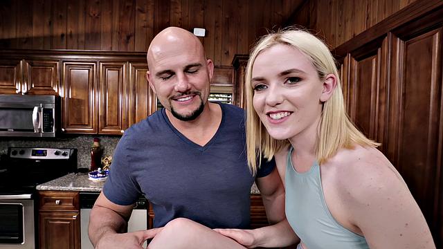 Blonde cutie serves a hard dick in the kitchen, taking it from behind & giving a facial