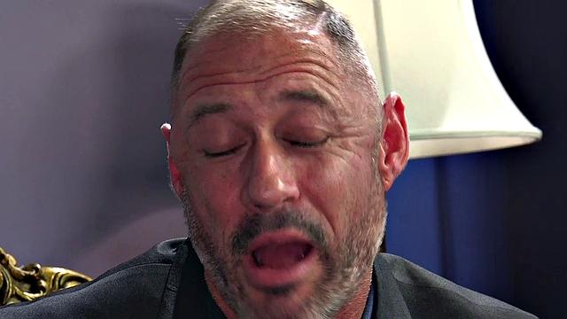 A busty redhead dominate her male submissive in a kinky bondage scene