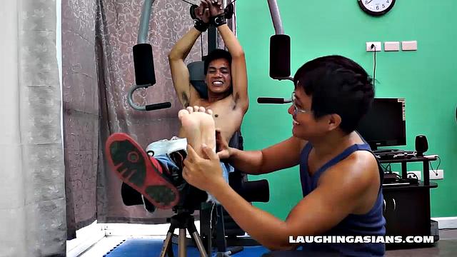 If you love male foot tickling, you're going to love this one! Cute Asian Boy Argie Comes by for a Gym Workout with His Trainer. The Gym Trainer Secures Argie for Vigorous Leg Workout.