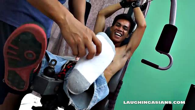 If you love male foot tickling, you're going to love this one! Cute Asian Boy Argie Comes by for a Gym Workout with His Trainer. The Gym Trainer Secures Argie for Vigorous Leg Workout.