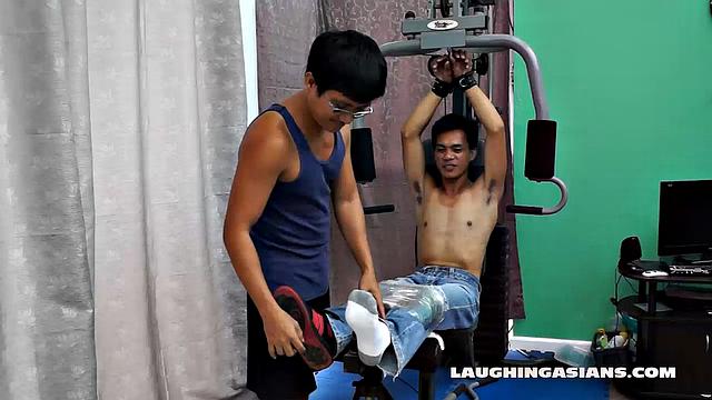 If you love male foot tickling, you're going to love this one! Cute Asian Boy Argie Comes by for a Gym Workout with His Trainer. The Gym Trainer Secures Argie for Vigorous Leg Workout.