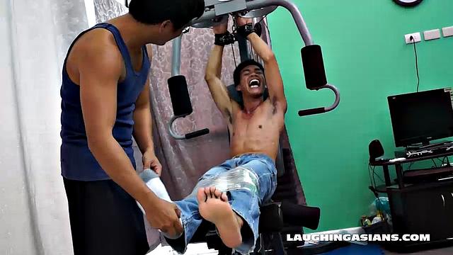 If you love male foot tickling, you're going to love this one! Cute Asian Boy Argie Comes by for a Gym Workout with His Trainer. The Gym Trainer Secures Argie for Vigorous Leg Workout.
