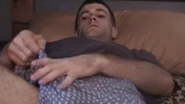 Kicked back on the bed, Johnny massages himself