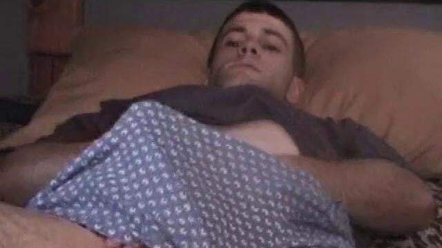 Kicked back on the bed, Johnny massages himself