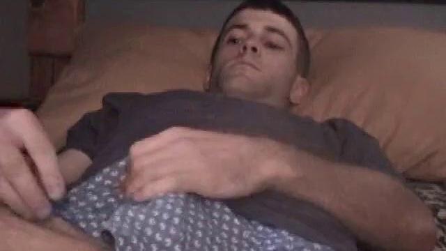 Kicked back on the bed, Johnny massages himself