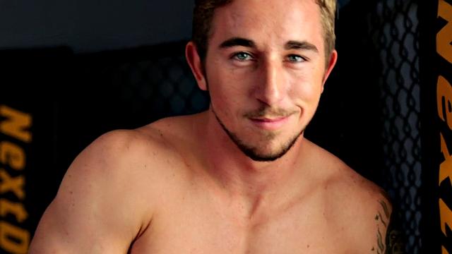 Tattooed stud masturbating in the gym