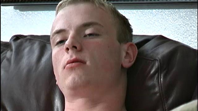 This tall, slender, well-hung young man is friendly, sweet, and a sexual dynamo. The 19-year-old bottom boy is on the sofa watching a porn video, as he peels off his clothes.