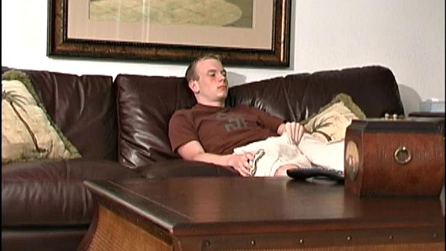 This tall, slender, well-hung young man is friendly, sweet, and a sexual dynamo. The 19-year-old bottom boy is on the sofa watching a porn video, as he peels off his clothes.