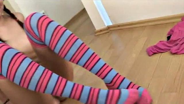 Stockinged teen masturbates