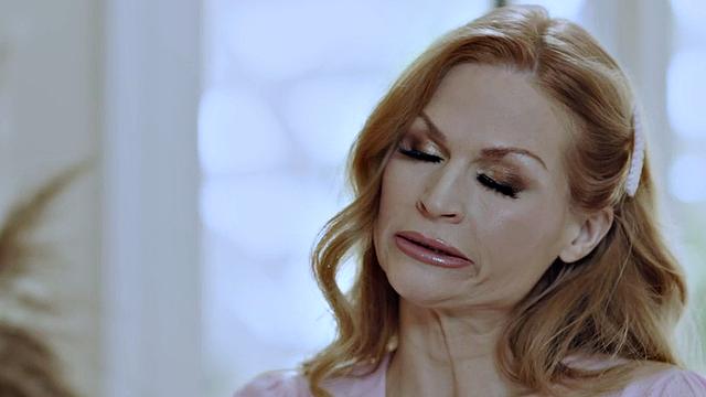 Redhead MILF passionately bounces on young cock