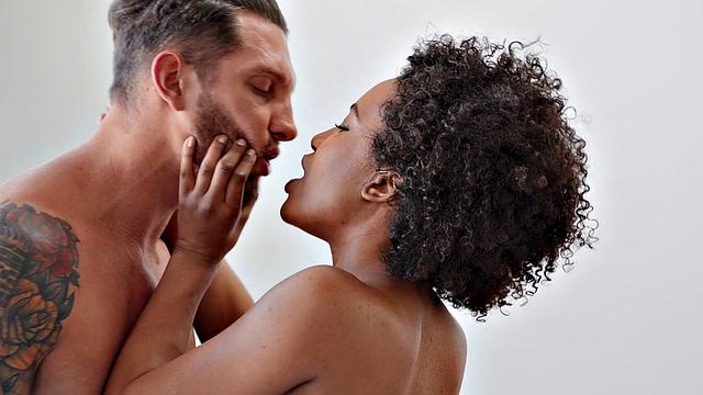 Curly-haired black babe gets her pussy fingered while riding in reverse cowgirl position