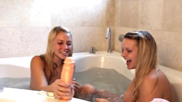 Tiny Becky and girlfriend share bathtub with large dildo!